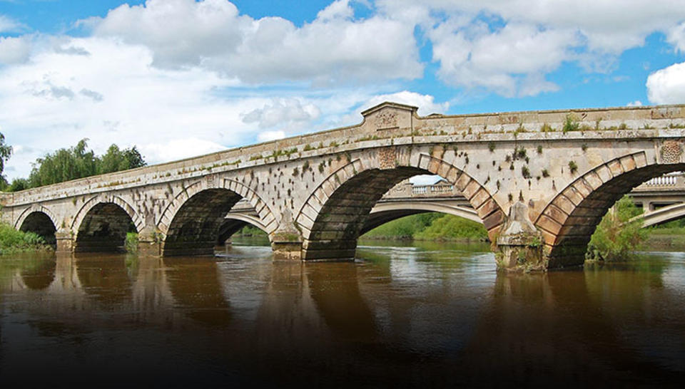 Shropshire bridge over river with blue sky
